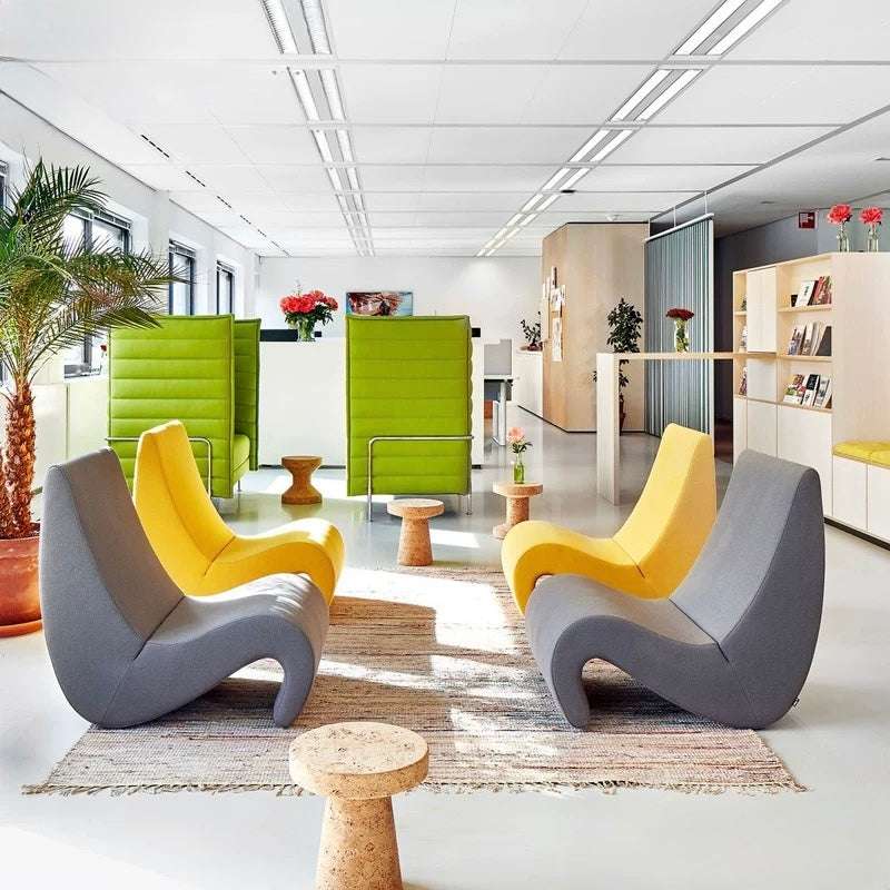 Modern office waiting area with colorful chairs and decor
