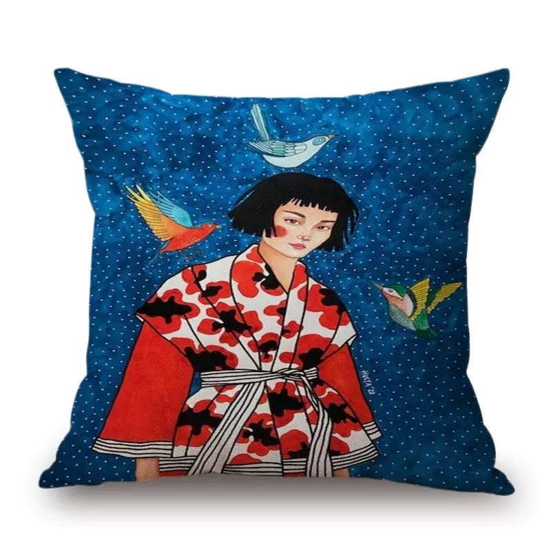 Decorative pillow with a woman in a kimono and birds design on a blue background