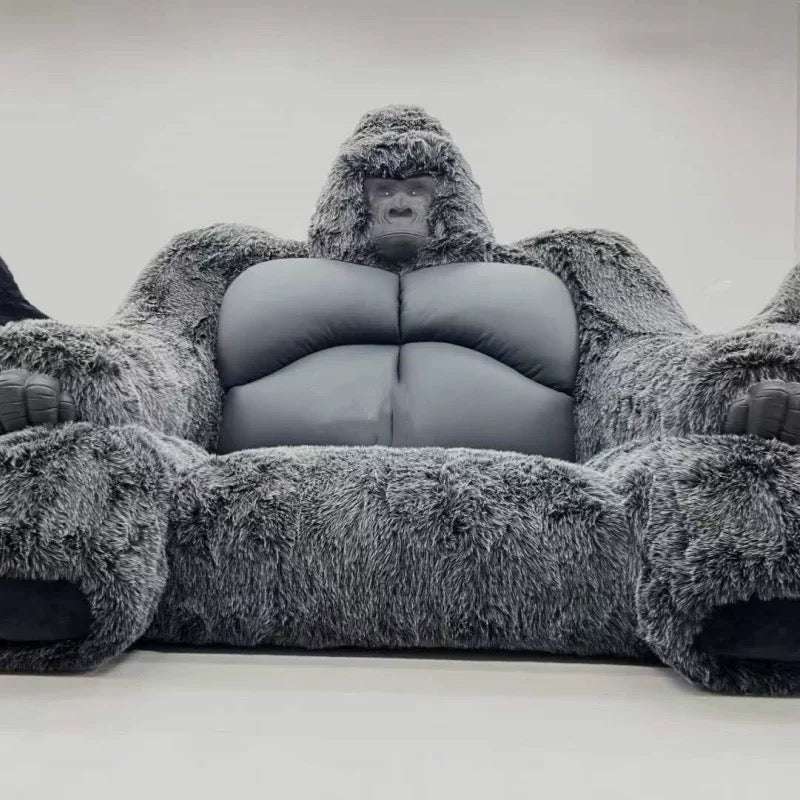 Gray gorilla-shaped chair on a white background