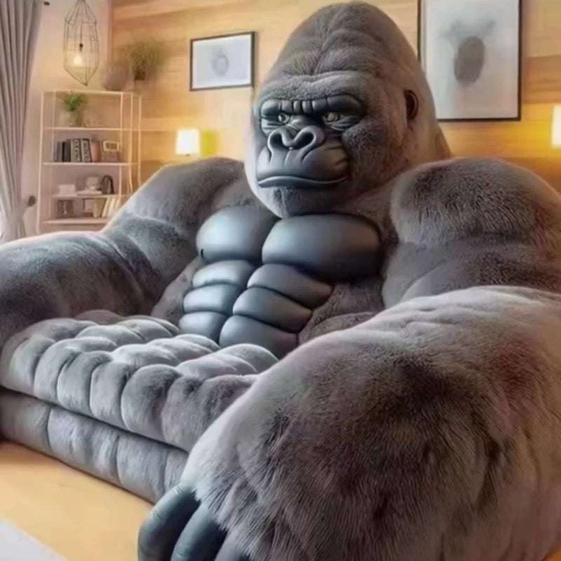 Gray gorilla-shaped bean bag chair in a room setting.