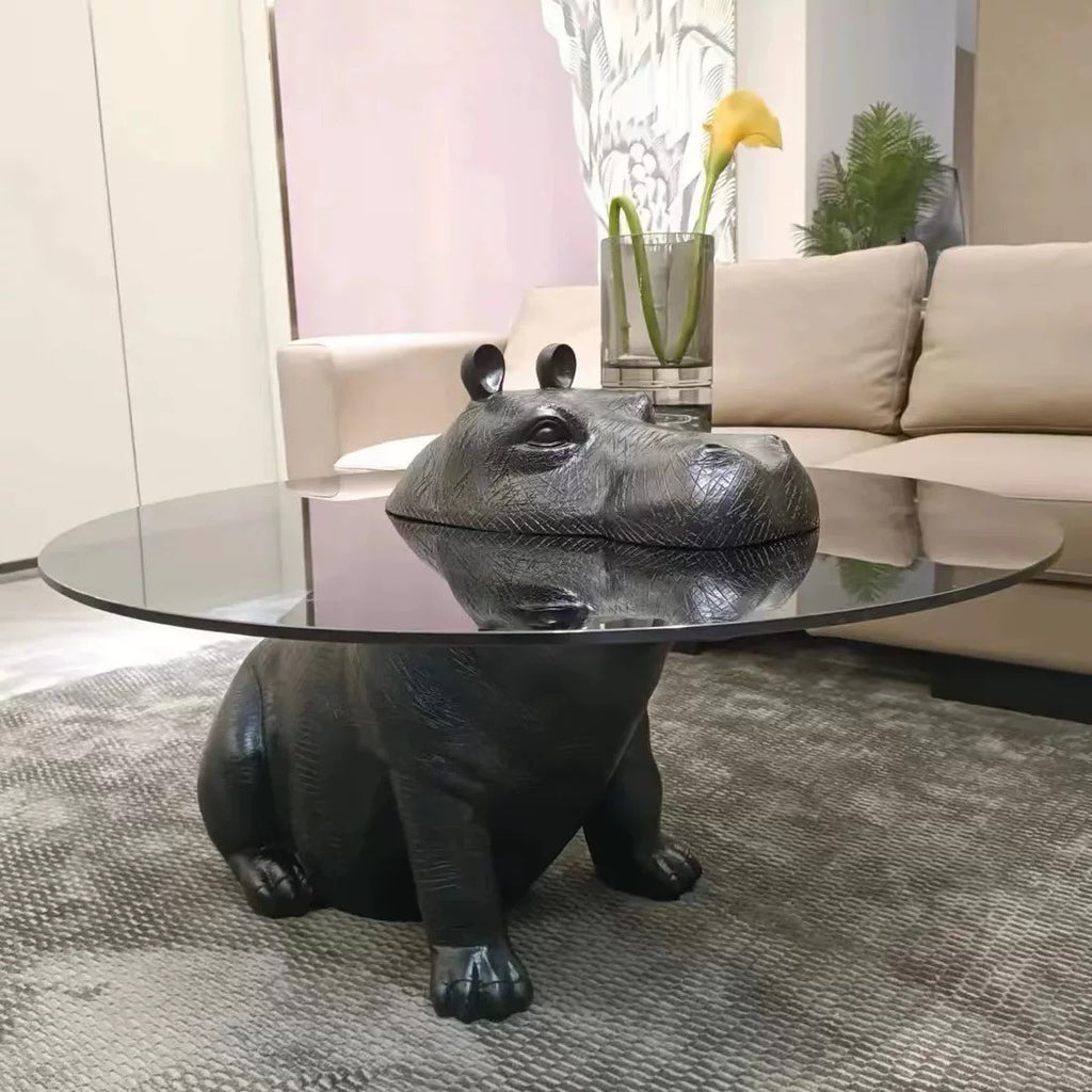 Hippo-shaped coffee table in a living room setting with a couch and decorative elements.