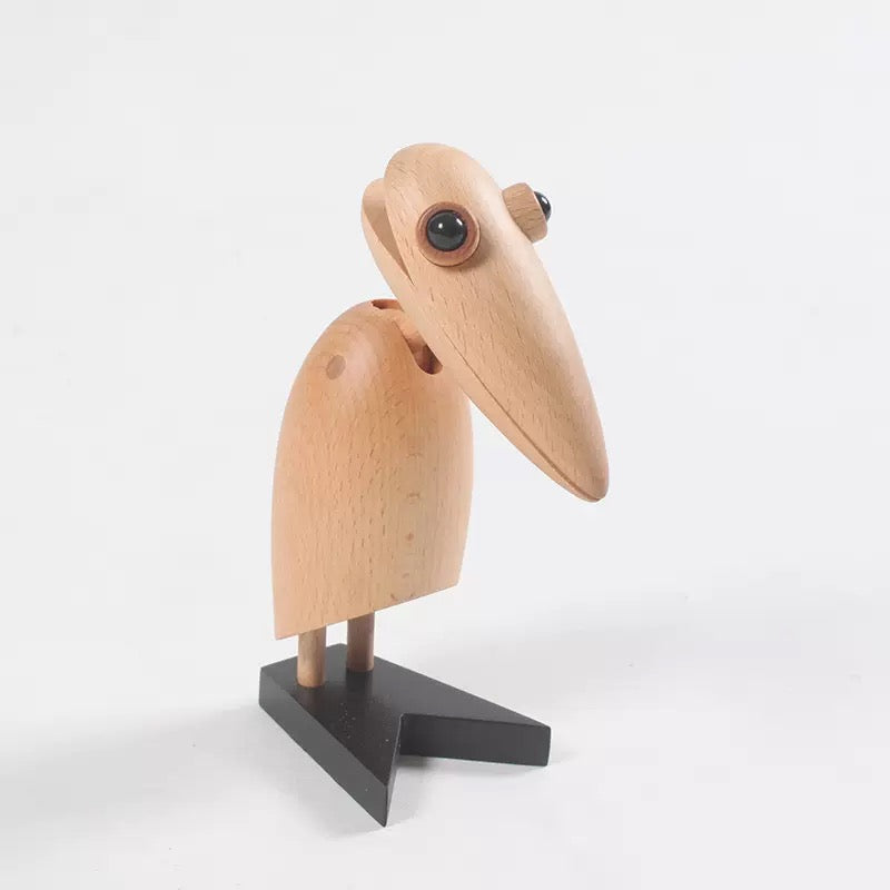 Wooden bird figurine on a white background