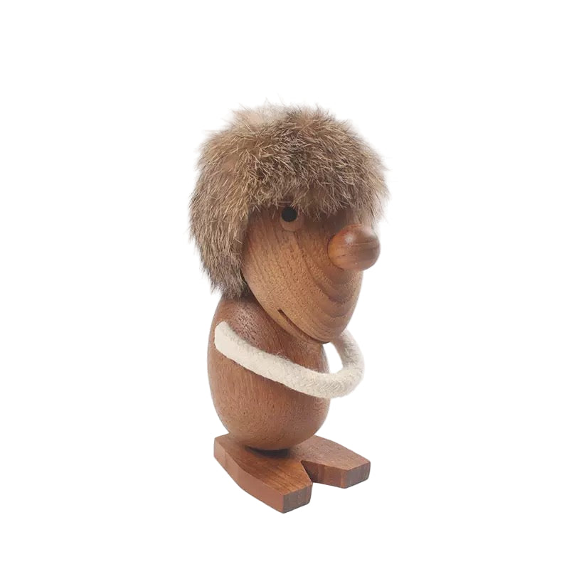 Wooden figurine of a creature with fur and a white ring on a white background