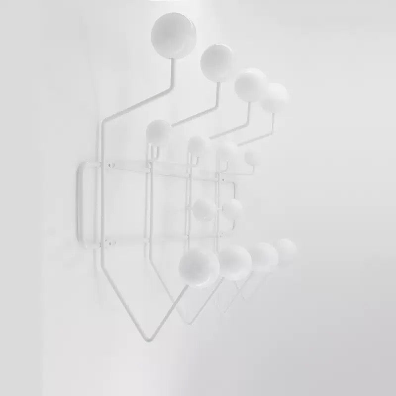 White geometric wall art on a light gray background