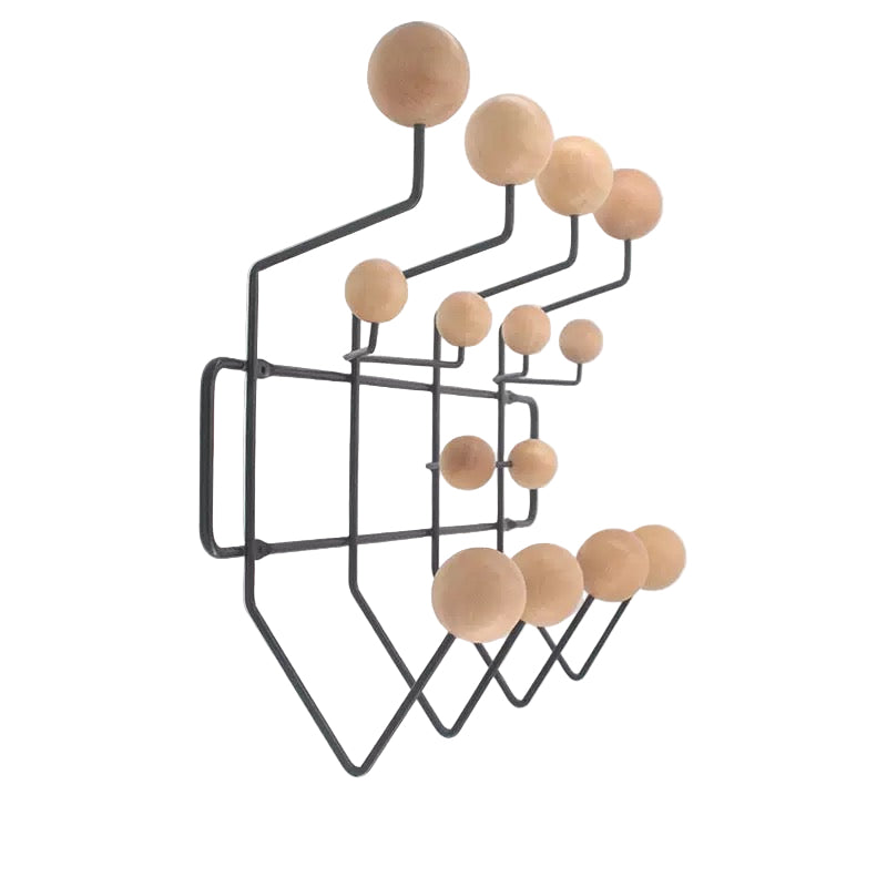 Wall-mounted coat rack with black metal frame and wooden hooks on a white background