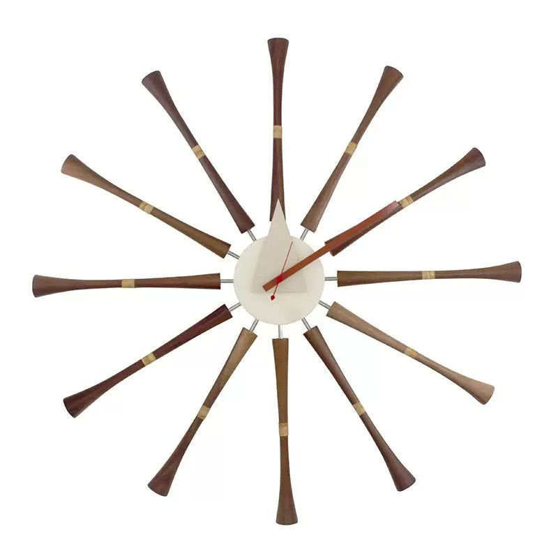 Decorative wall clock with wooden arms on a white background