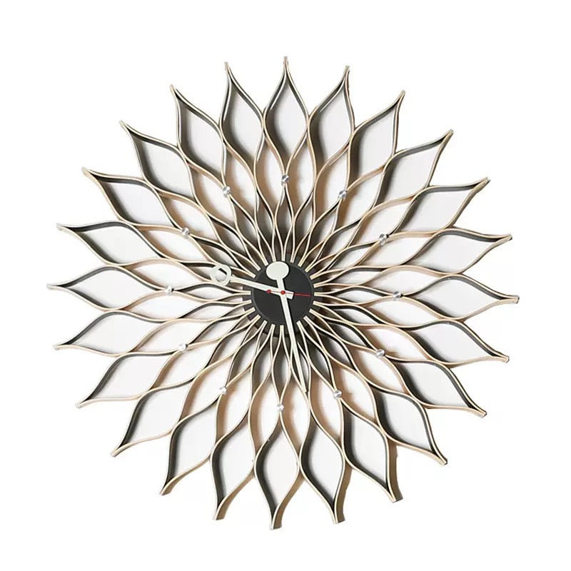 Decorative wall clock with a sunflower design on a white background