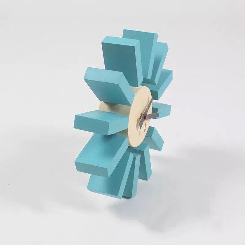 Blue geometric clock on a white background