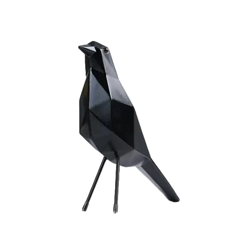 Black bird-shaped object on a white background