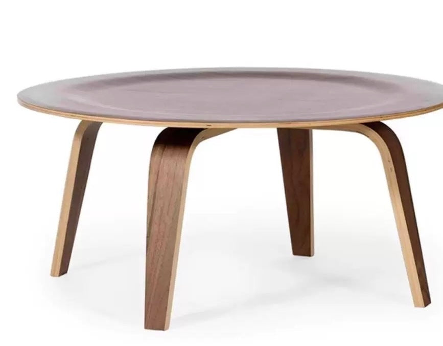 Round coffee table with a purple top and wooden legs on a white background