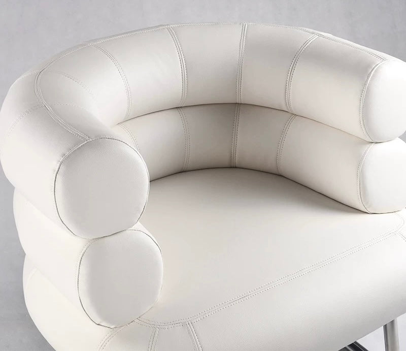 White leather chair with a modern design on a gray background