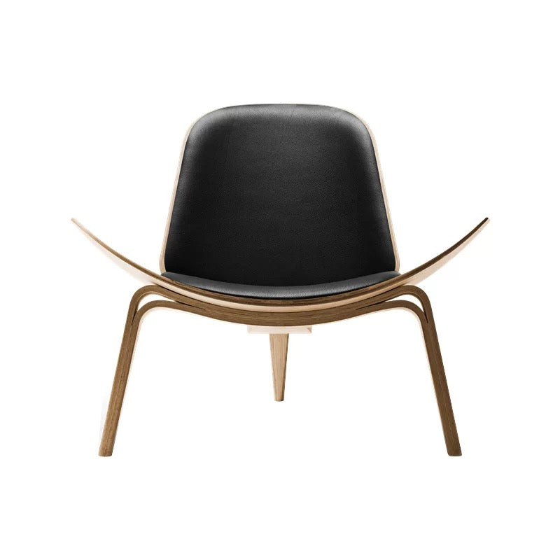 Modern chair with black seat and gold frame on a white background
