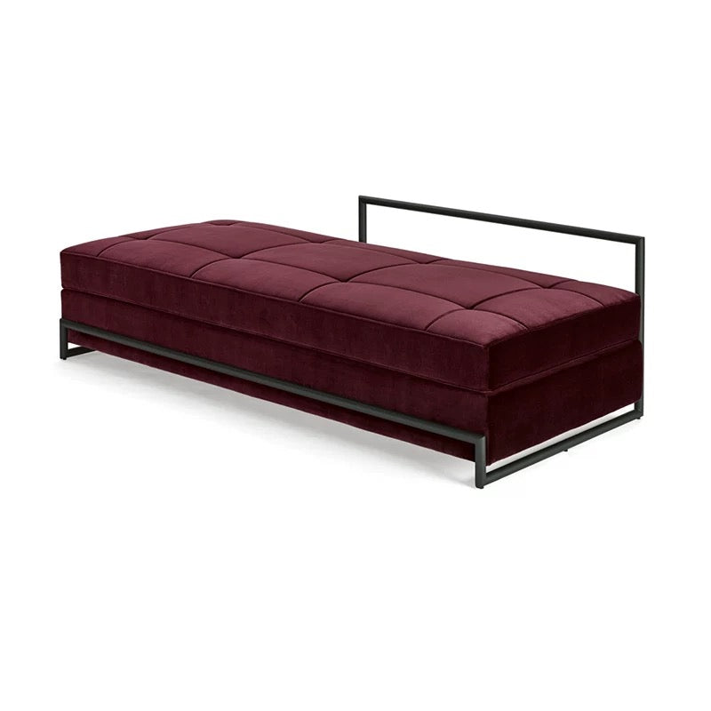 Maroon upholstered bench with black metal frame on a white background
