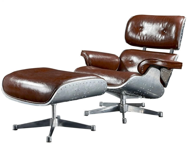Brown leather lounge chair and ottoman with metal base on a white background