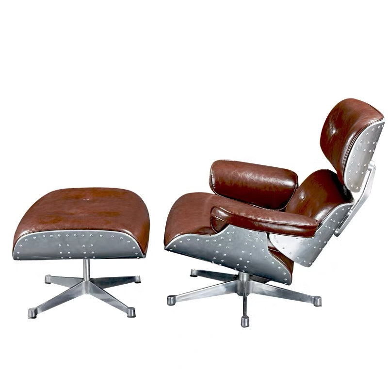 Brown leather chair and ottoman with silver metal base on a white background