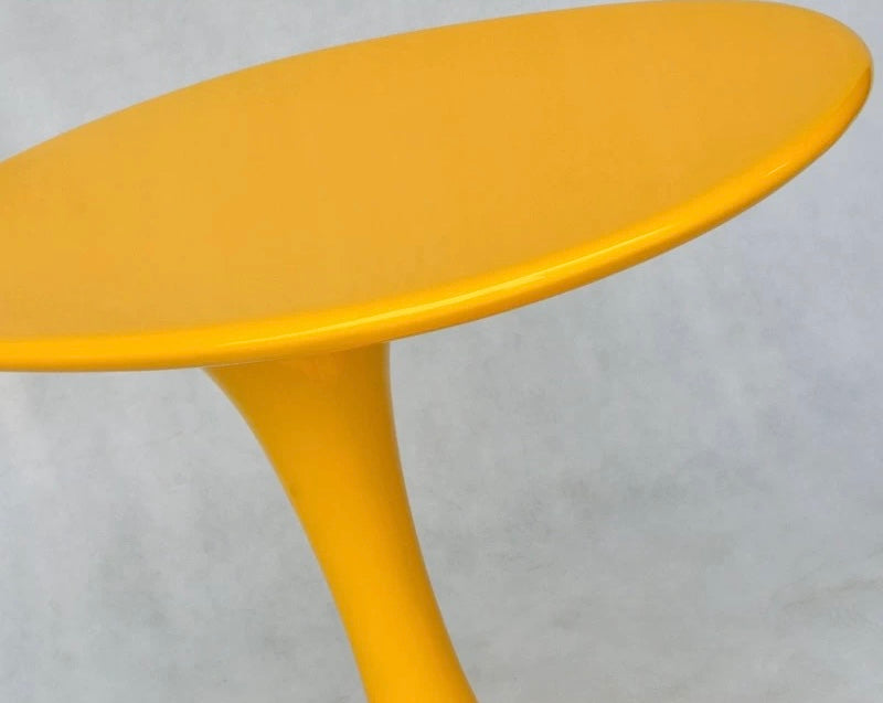 Yellow side table on a light gray background