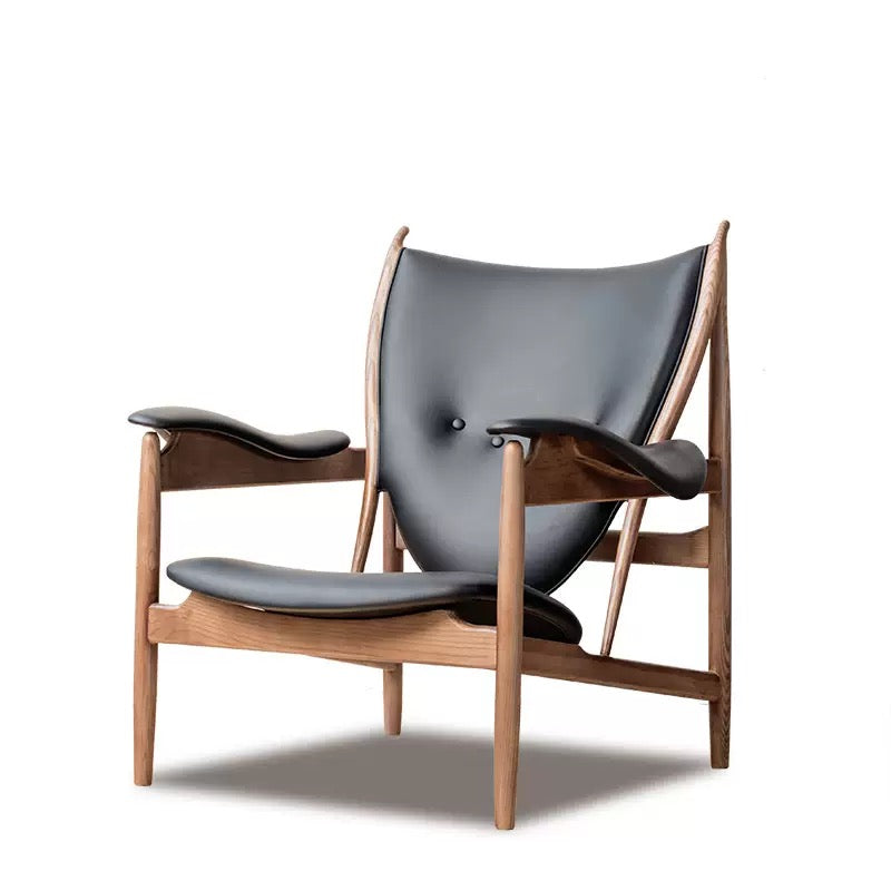 Modern chair with black leather seat and backrest on a white background