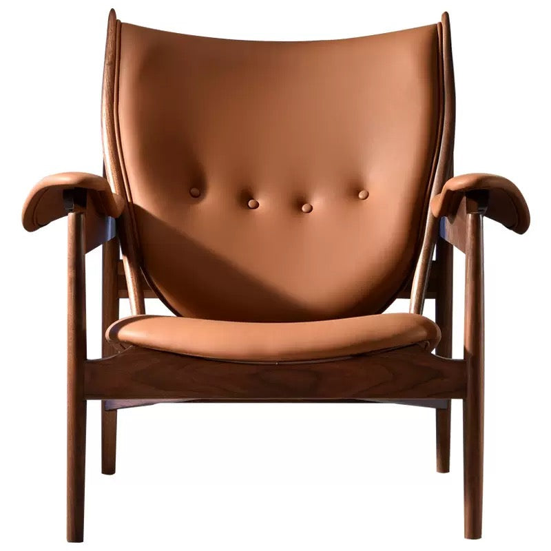 Brown leather armchair with wooden frame on a white background