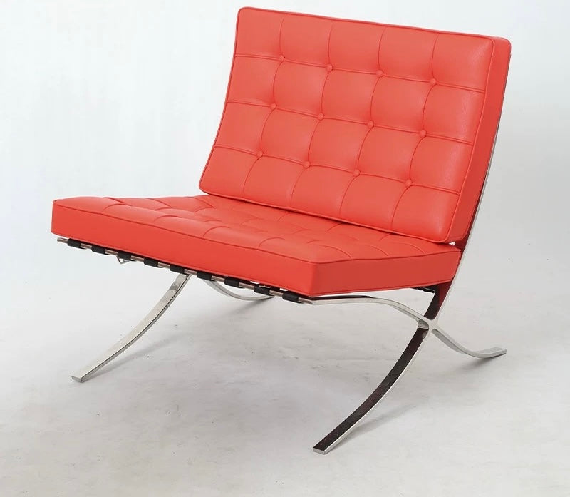Red leather chair with metal frame on a white background