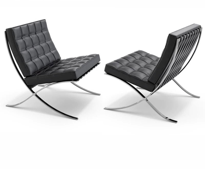 Two modern black chairs with chrome frames on a white background
