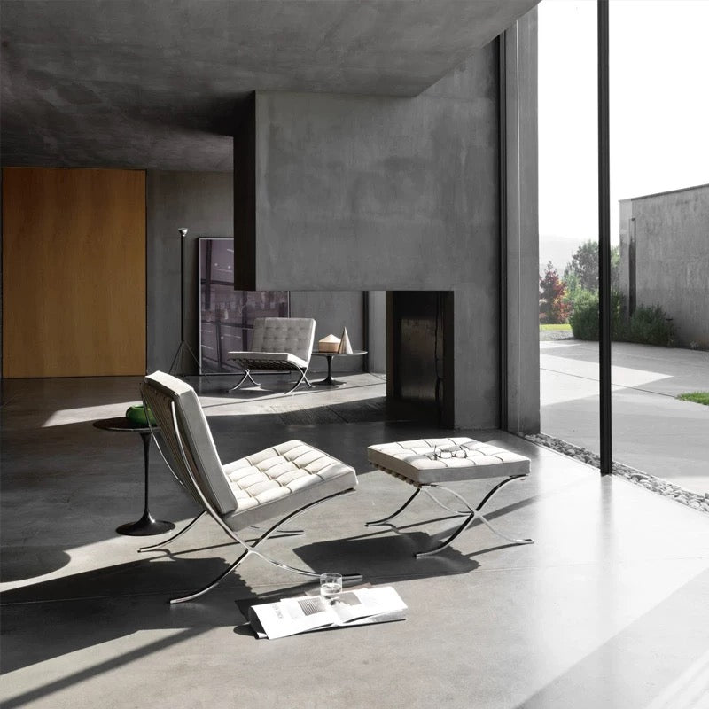 Modern living room with a minimalist design featuring a chair and coffee table.