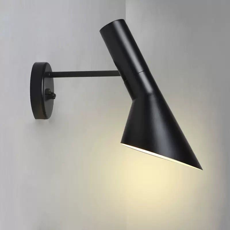 Black wall-mounted lamp on a light gray background