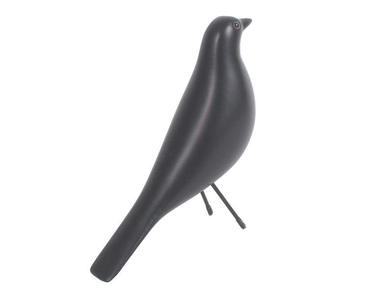 Black bird-shaped sculpture on a white background
