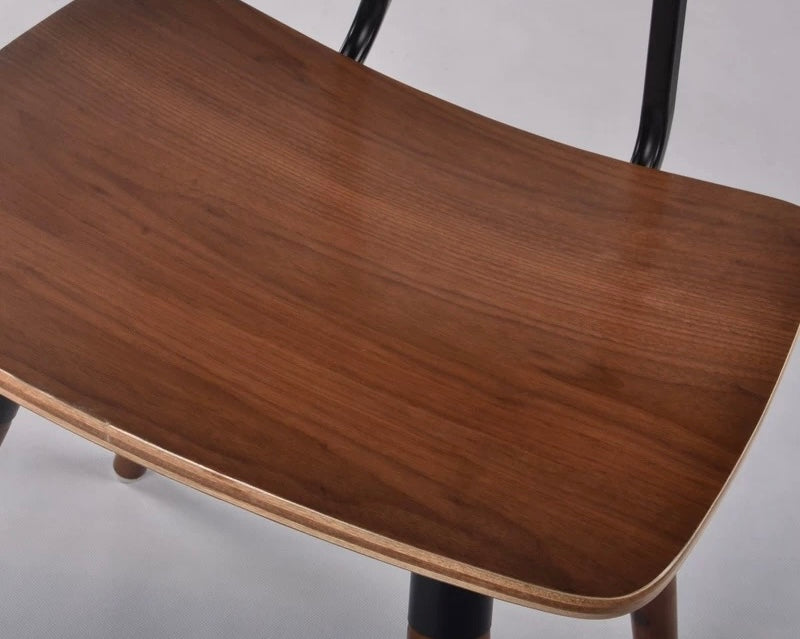 Wooden chair seat with a plain background