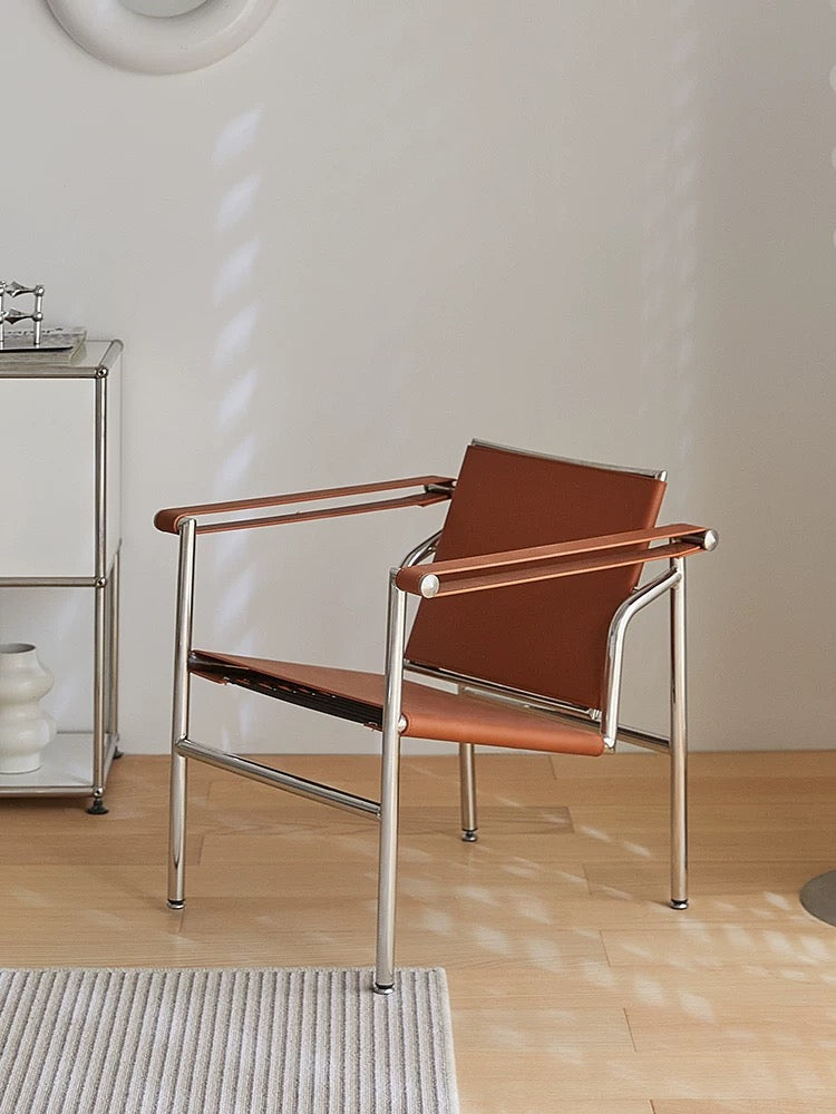 Brown chair with metal frame in a minimalistic room