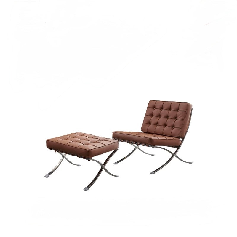 Brown leather chair and ottoman set on a white background