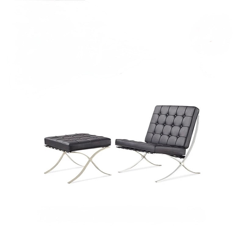 Modern black chair and ottoman set on a white background