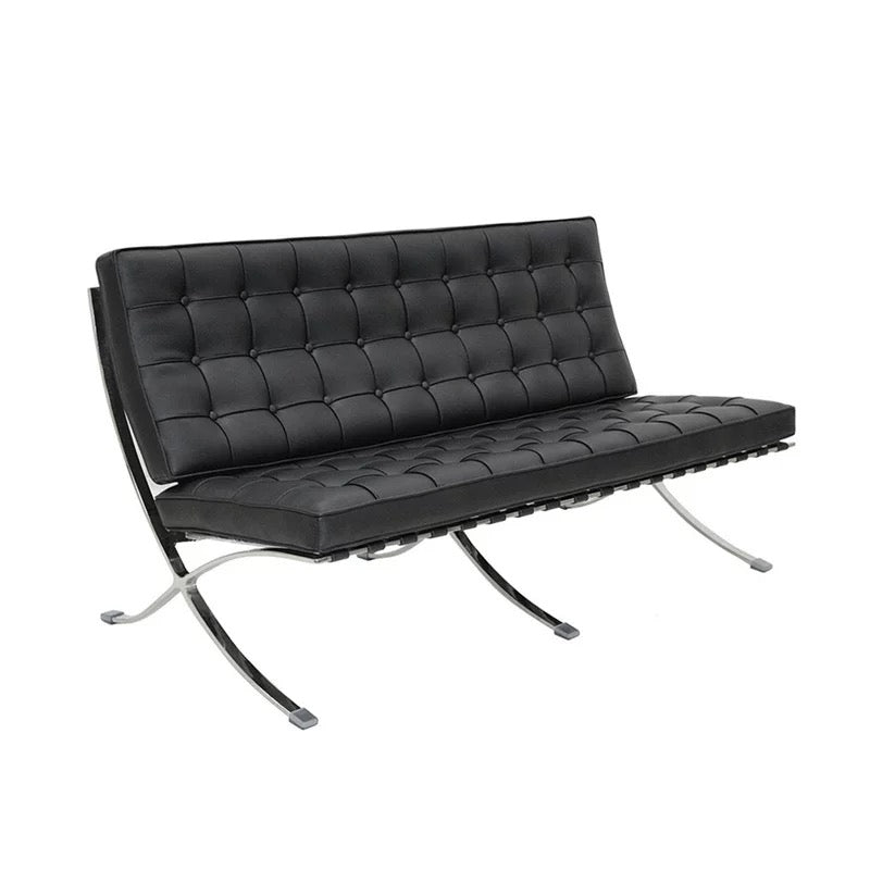 Black leather sofa with chrome frame on a white background