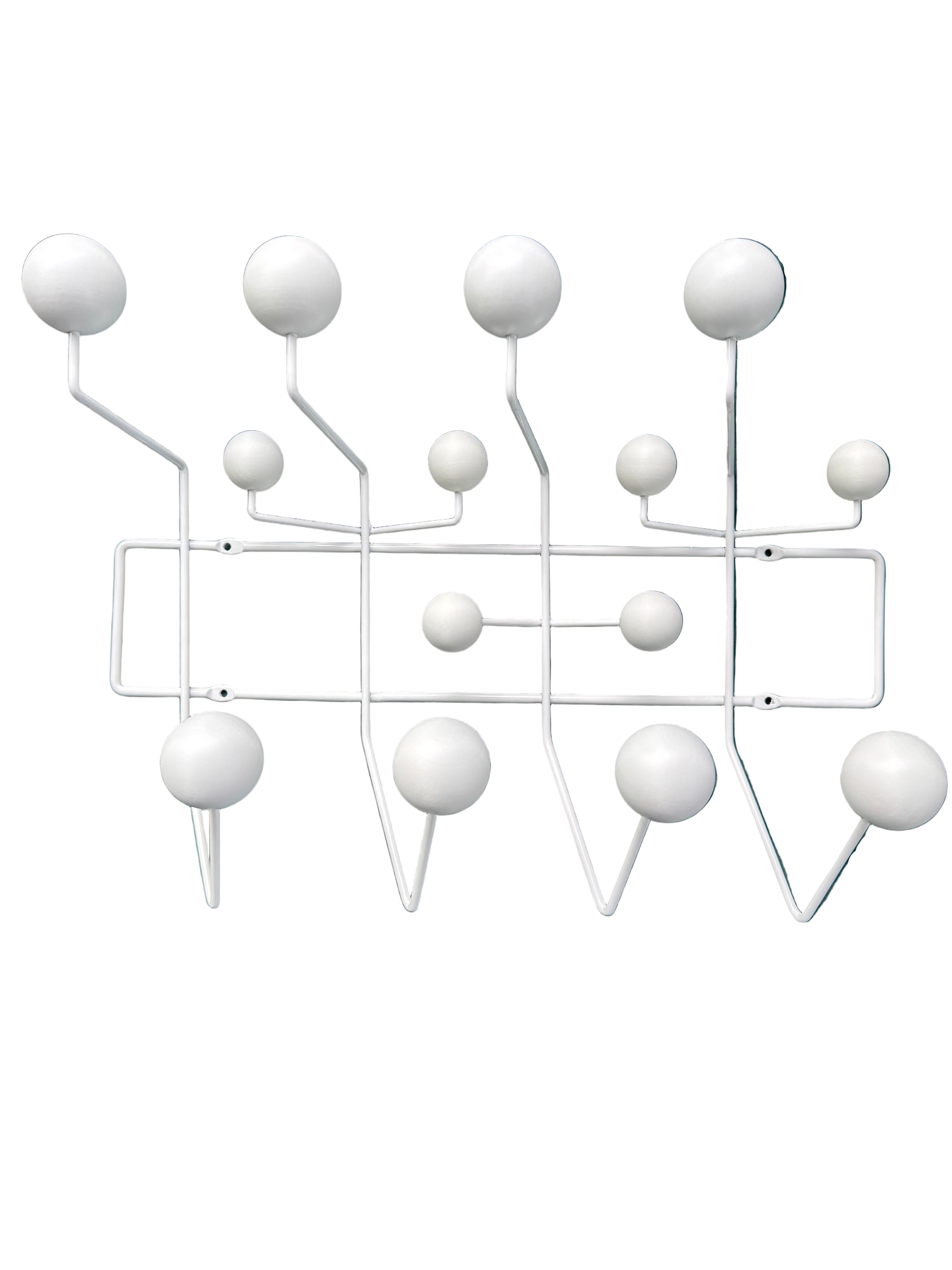 Wall-mounted coat rack with white hooks on a teal cushioned surface