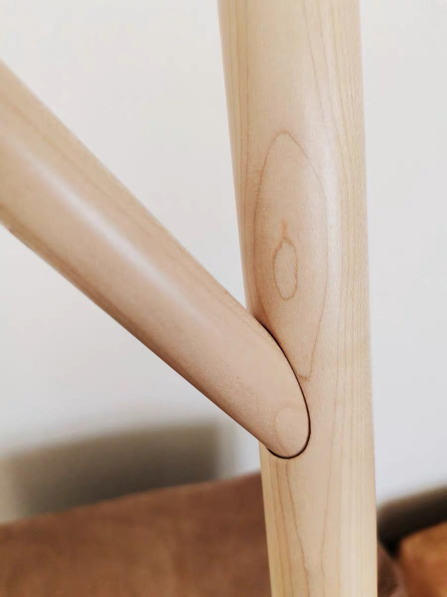 Close-up of a wooden chair with a blurred background