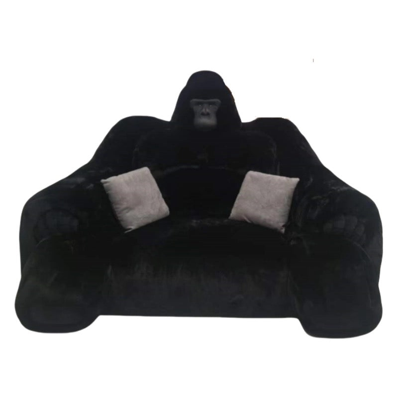 Black gorilla-shaped bean bag chair with gray cushions on a white background