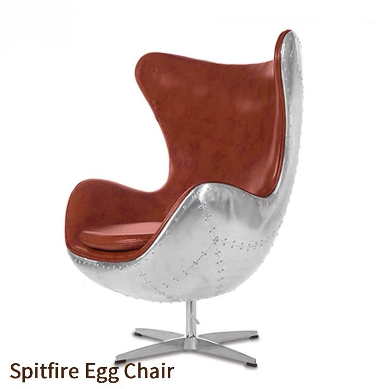Spitfire Egg Chair with brown leather seat and metallic silver shell on a white background