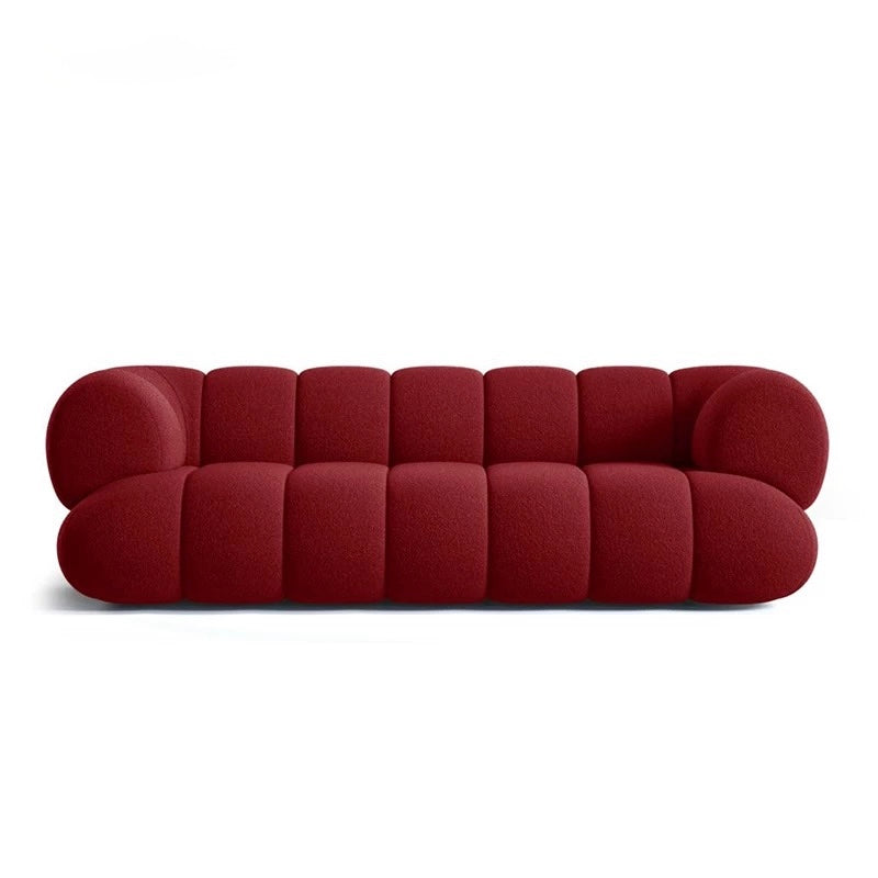 Red sofa with a modern design on a white background
