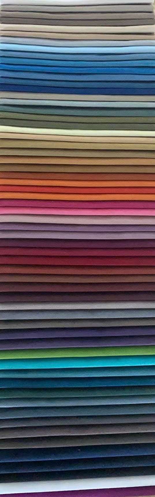 Stack of colorful fabric swatches arranged vertically.